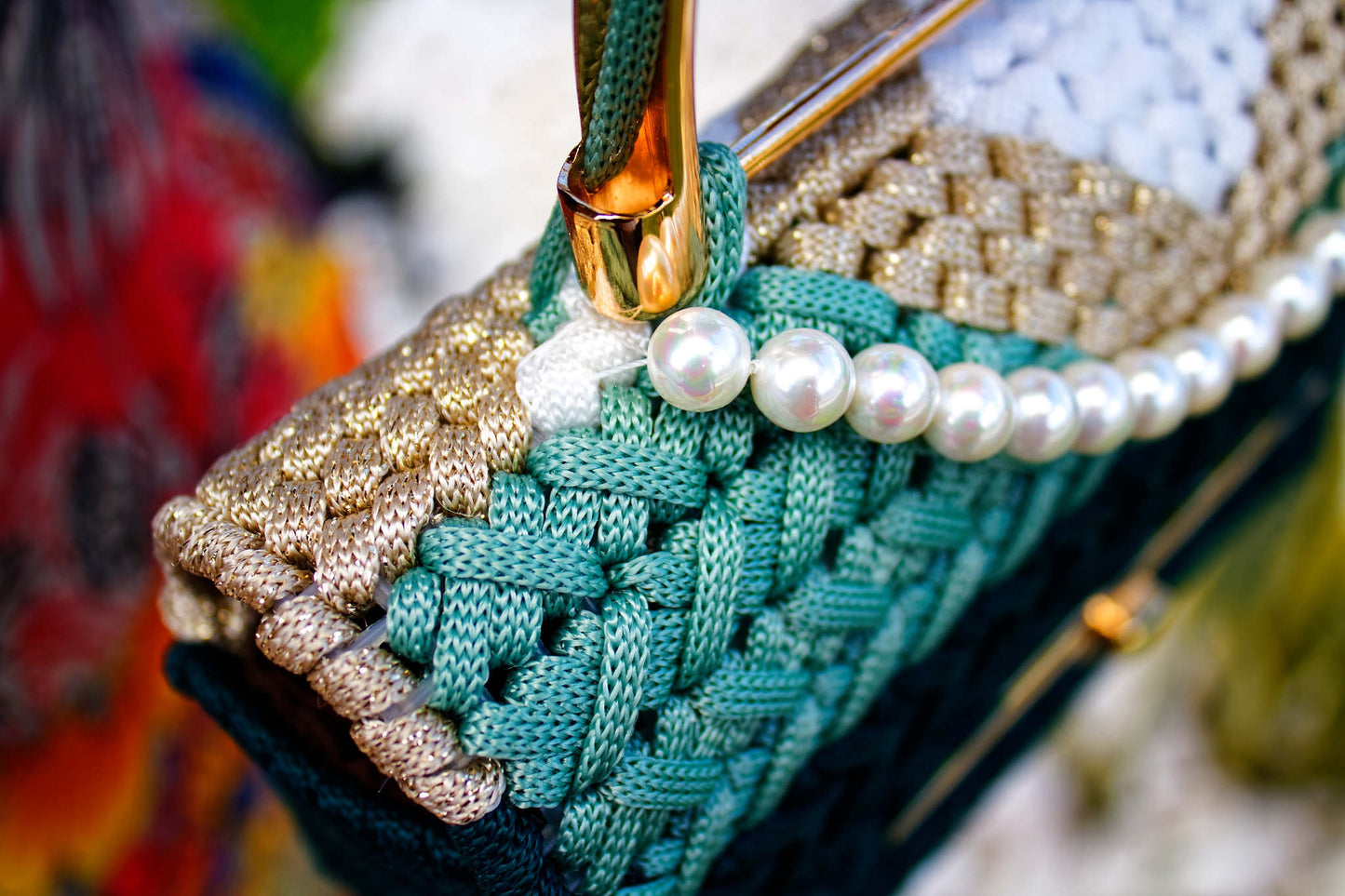 WholEmollient Atelier The I. Collection Emerald Tide — close-up of pearl trim, sage and mint cord detail, and gold turn-lock clasp